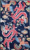 A Tibetan 'dragon' rug, 5ft 6in. x 3ft                                                                                                 