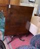 A George III mahogany tilt top breakfast table, formerly a central section of a larger table, width 90cm, depth 96cm, height 72cm                                                                                           