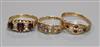 Two early 20th century 15ct gold and gem set rings and a similar 18ct gold and gem set ring.                                           