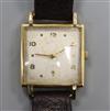 A gentleman's stylish 9ct gold Baume square cased manual wind wrist watch.                                                             