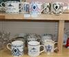 A collection of sixteen commemorative Wedgwood mugs designed by Richard Guyatt                                                         