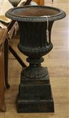 A cast iron urn on stand W.38cm                                                                                                        