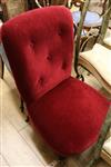 A red buttoned velvet nursing chair                                                                                                    