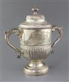 A late Victorian demi-fluted silver two handled pedestal presentation cup and cover, by John Newton Mappin, 47.4 oz.                   