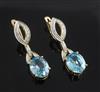 A pair of modern 18ct gold, blue zircon and diamond drop earrings, 36mm.                                                               