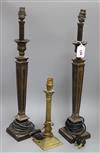 A pair of bronze lamps and a smaller brass lamp smaller height 60cm                                                                    