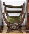 A Victorian brass mounted oak Savonarola chair                                                                                         