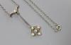 An Edwardian yellow and white metal, seed pearl and diamond set cluster drop pendant necklace                                                                                                                               