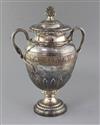 A George IV silver two handled presentation pedestal trophy cup and cover by Benjamin Smith III, 72.5 oz.                              