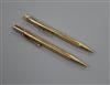 A 9ct gold cased pencil and a 585 cased pen.                                                                                           