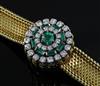 A lady's 18ct gold Jaeger Le Coultre 18ct gold, emerald and diamond set cocktail bracelet watch, overall length 17.2cm.                