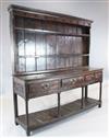 A George III oak dresser, W.6ft 4in. D.1ft 6in. H.6ft 10in.                                                                            