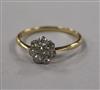 A yellow metal and diamond cluster flower head ring, size S.                                                                           
