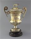 A handsome George III silver gilt two handled presentation pedestal trophy cup and cover by William Elliot, 93.5 oz.                   