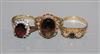 Three assorted 9ct gold and gem set dress rings.                                                                                       