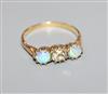 A yellow metal, white opal and diamond set three stone ring, size O.                                                                   