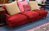 A large red chenille three seat sofa 240cm long                                                                                        