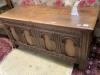 An 18th century and later oak coffer with arch panelled front, width 142cm depth 52cm height 68cm                                                                                                                           