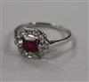 A white metal, ruby and diamond cluster ring, size M.                                                                                  