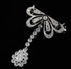 A 1920's pierced platinum? and millegrain set diamond drop brooch, 3cm.                                                                