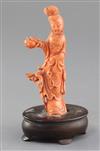 A Chinese carved coral figure of a lady, mid 20th century, total height 17.5cm                                                         