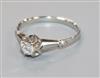 An 18ct white gold and claw set solitaire diamond ring, size N.                                                                        