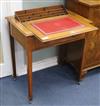 A late Victorian mahogany writing table with hidden stationary compartment W.71cm.                                                     