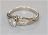 An 18ct white gold and collet set solitaire diamond ring, size L.                                                                      