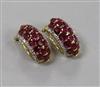 A modern pair of 18ct gold, ruby and diamond cluster half hoop ear clips, 19mm.                                                        