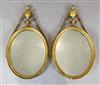 A pair of George III giltwood and gesso oval wall mirrors, W.1ft 5in. H.2ft 7.5in.                                                     