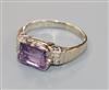 An 18ct white gold and emerald cut amethyst ring with diamond set shoulders, size P.                                                   