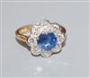 A modern 18ct gold, sapphire and diamond cluster flower head ring, size O.                                                             