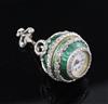 An early 20th century continental silver gilt, green enamel and diamond set ball timepiece pendant,                                    