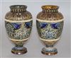 A pair of Doulton Lambeth reticulated pate sur pate decorated vases, dated 1883, H.18cm.                                               