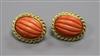 A pair of yellow metal and fluted coral oval earrings, 24mm.                                                                           