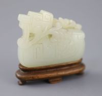 A Chinese archaistic pale celadon jade mandarin duck carving, 19th century, 5cm excluding wood stand                                   