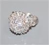 An ornate white metal, baguette and round cut diamond set cluster dress ring, size K.                                                  