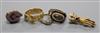 A George III yellow metal, seed pearl and enamel mourning ring, two other diamond rings, a bloodstone fob pendant and hand clasp.      