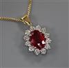 An 18ct gold and platinum ruby and diamond cluster pendant on 18ct gold fine chain, pendant 12mm.                                      