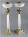 A pair of Victorian Hinks & Son's Patent silver plate mounted cut glass oil lamps, height 22.75in.                                     
