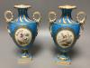 A pair of mid 19th century Coalport turquoise ground two handled vases, painted in Sévres style with birds in gilt panels 20.5cm                                                                                            