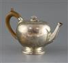 A Victorian silver bullet shaped teapot, by Walter Morrisse, gross 17oz.                                                               