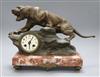 A spelter clock modelled as a tiger, on a marble base, signed T Cartier height 30cm                                                    