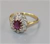 An 18ct gold, ruby and diamond oval cluster ring, size L.                                                                              