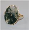 A 9ct gold and moss agate oval ring, size F.                                                                                           