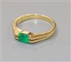 An 18k and solitaire emerald ring, size O/P.                                                                                           
