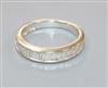 An 18ct white gold and baguette cut diamond set half eternity ring, size J.                                                            