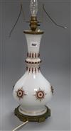 A French 'jewelled' opaline white glass table lamp, heightened in gilt height 45cm                                                     