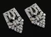 A pair of Art Deco diamond dress clips, of typical openwork geometric form, millegrain-set in platinum, 27mm.                          