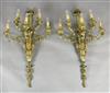 A pair of late Victorian ornate cast brass five branch wall lights, width 22in. depth 11in. height 39in.                               